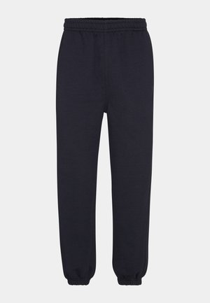Pantalones de chándal azul marino con cinturilla elástica, piernas ajustadas y puños acanalados. Fabricados en un material de algodón suave, con una textura lisa.