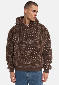 Brown fleece hoodie featuring a paisley pattern, a front pocket, adjustable drawstring hood, and ribbed cuffs and hem.