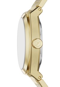 Guldtonet metalur med en glat, børstet finish. Har et rundt, fladt urkasse og en tekstureret krone. Minimalistisk design, ingen synlig urskive.