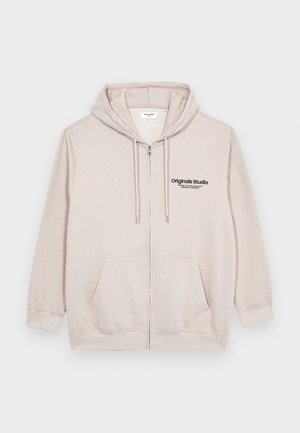 Hellbeige Zip-Hoodie aus weichem Material, mit einem Frontlogo, zwei Seitentaschen und einer Kapuze mit Kordelzug.