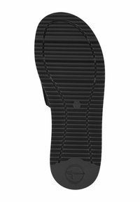 Suola di scarpa in gomma nera con scanalature orizzontali e un logo circolare vicino al tallone. Il design presenta una superficie testurizzata per una migliore aderenza.