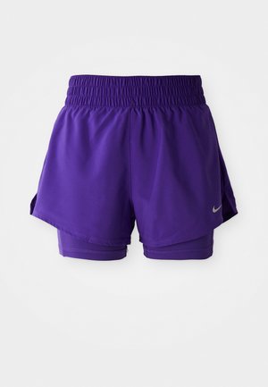 Purple double-layer running shorts with elastic waistband and small silver Nike swoosh on lower left hem.