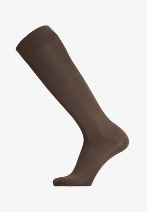 Braune knielange Socke aus glattem, dehnbarem Material mit geripptem Bund. Verfügt über verstärkte Zehen und Ferse für zusätzliche Haltbarkeit.