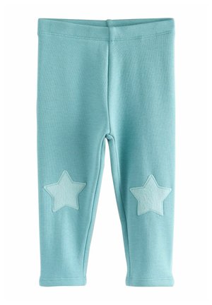 Lichtblauwe leggings van zachte stof, met aan elke zijde twee stervormige applicaties in een iets donkere tint.