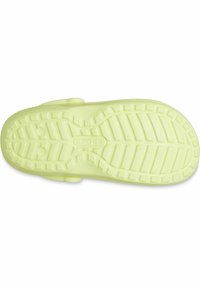 Suola di scarpa in gomma gialla brillante con un pattern di grip testurizzato, caratterizzata da indentations circolari e rettangolari, e un piccolo logo al centro.