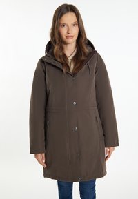Bruine gewatteerde parka met een rits- en drukknoopsluiting, verstelbare trekkoorden, zijzakken en een licht gestructureerde stof.