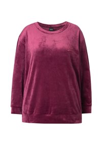 Pehmeä, syvän burgundinpunainen collegepaita pitkillä hihoilla, pyöreällä kaula-aukkolla ja brodeeratuilla yksityiskohdilla. Pehmeä samettinen tekstuuri ja rento malli.