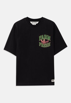 Black cotton t-shirt featuring a graphic print in green and pink text that reads “FARM FRESH,” with a loose fit and short sleeves.