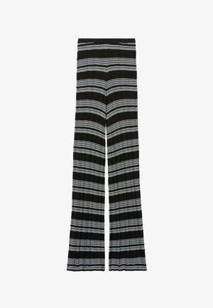 Pantalon noir côtelé avec des rayures horizontales blanches et une coupe à jambes larges, présenté à plat sur un fond blanc.