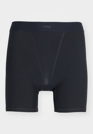 Mustad mustad pokkerid, mis on valmistatud siledast kangast, laia elastse vöökoha ja "sloggi" logoga ning keha järgiva disainiga.