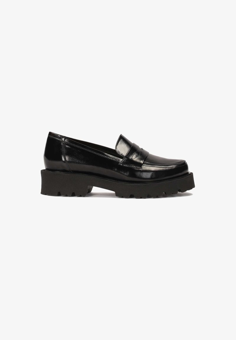 Black patent leather loafers with a raised front section, thick black rubber outsole, and pronounced tread pattern.