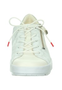 White leather sneaker with a smooth texture, featuring flat laces, side zipper, and red-tipped lace aglets. Solid white rubber sole.