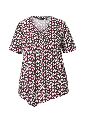 Kurzärmlige Bluse aus schwarzem Stoff mit einem Herzmuster in Weiß und Rot. Sie verfügt über einen Rundhalsausschnitt und einen asymmetrischen Saum.