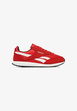 Red low-top Reebok sneaker with white side stripes, red laces, black inner lining, and white sole with textured black outsole.