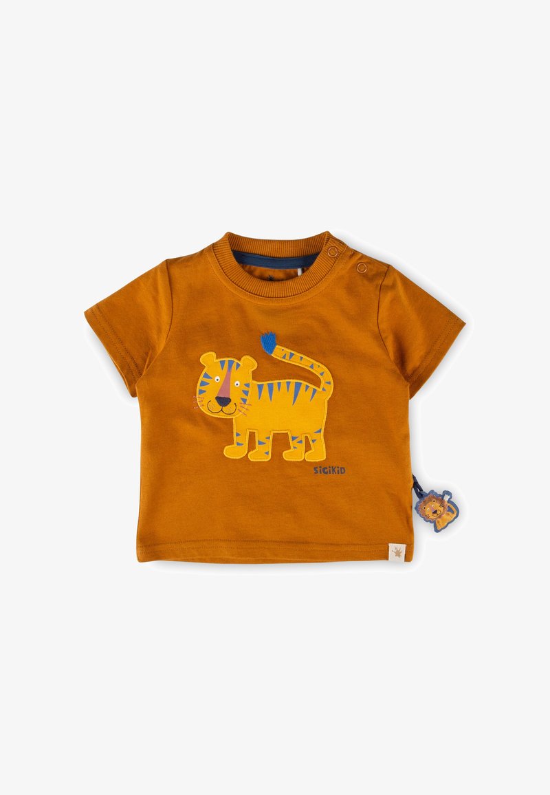 Chemise pour tout-petit couleur rouille avec une application de tigre jaune à rayures bleues et une petite étiquette en forme de lion sur le côté.
