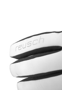 White gloves with black accents, featuring a textured exterior and stitched details. The brand name "reusch" is visible on the cuff.