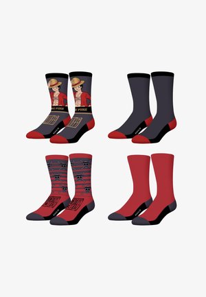 Quatre paires de chaussettes montantes en noir et rouge, dont deux avec Monkey D. Luffy et des logos de crâne de l'anime One Piece, et deux paires de couleur unie.