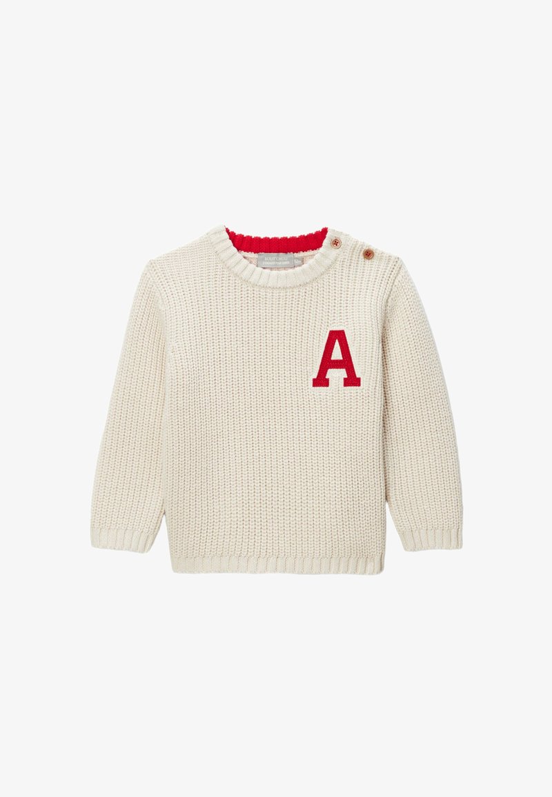 Pull crème tricoté avec un col rouge et une lettre "A" rouge brodée sur la poitrine, avec des fermetures à boutons latérales.
