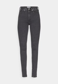 Skinny jeans in dark grey denim with a high waist, featuring front pockets, a button closure, and contrasting stitching along the seams.