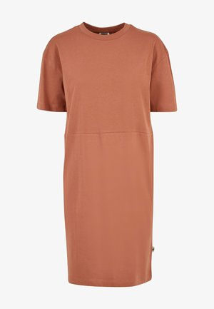 Lühikeste varrukatega t-särk kleit roostepunasest toonist, valmistatud pehmest puuvillast kangast. Omab lõdva silueti ja sirget lõiget ning diskreetseid õmbluse detaile.