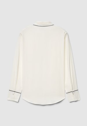 Langärmliges weißes Hemd mit schwarzer Paspel entlang des Kragens und der Manschetten, verfügt über eine glatte Textur und einen abgerundeten Saum.