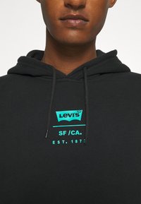 Levi's® RELAXED GRAPHIC - Sweatshirt com capuz - black