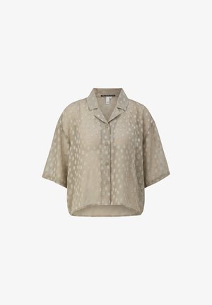 Beżowa koszula z krótki rękawem i zapinaniem na guziki, o krótkim kroju, z fakturowanym wzorem w kropki i kołnierzykiem.