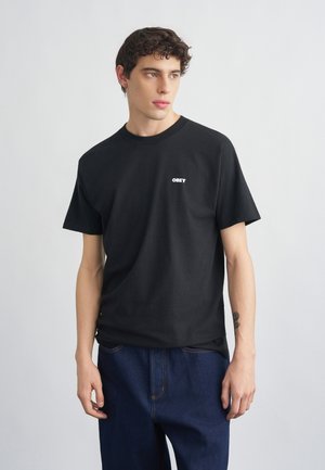 THE MEDIUM IS THE MESSAGE - Tričko s potlačou - black