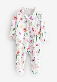 Mono de estampado floral en blanco, con flores rosas y moradas. Tiene mangas largas, cierres a presión y puños con volantes y lazos.