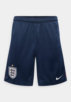 Pantalones cortos deportivos azul marino con cintura elástica, escudo de fútbol de Inglaterra en la pierna izquierda y logo blanco de Nike en forma de garra en la pierna derecha.