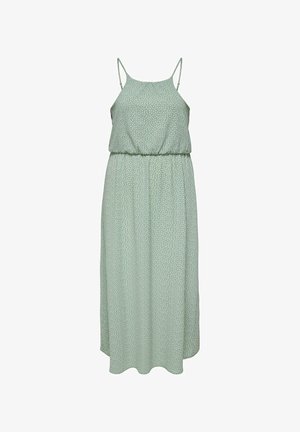 Rochie midi verde deschis fără mâneci, cu bretele subțiri și buline mici albe, talie strânsă și fustă fluidă.