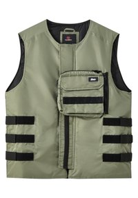 Veste sans manches vert olive avec fermeture éclair frontale, sangles noires réglables à velcro sur les côtés, et poche amovible zippée sur la poitrine.