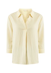 Camicia a maniche lunghe di un giallo chiaro con colletto, davanti plissettato e tessuto testurizzato. Presenta maniche con polsini e un taglio rilassato.