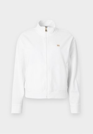 White zip-up jacket with a high collar, ribbed cuffs and hem, featuring a small gold logo on the left chest. Made from soft fabric.