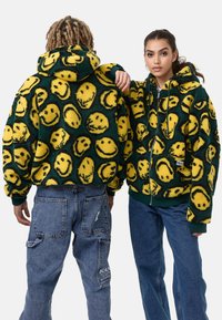 Karl Kani SIGNATURE SMILEY FULL ZIP UNISEX - Bunda z nepravej kože - green/yellow/black