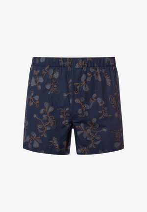 Herren Bade shorts aus marineblauem Stoff mit einem floralen Muster in Braun und Hellblau. Elastischer Bund mit Knopfverschluss. Lässiges Design.