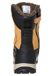 Hnědé a černé kožené boty s texturovaným povrchem, límcem z kožešiny a bočním zipem. Vyznačují se vícesměrným vzorem na podrážce.