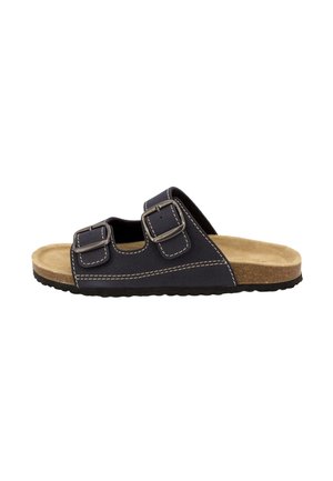 Sandalo nero tipo slide con due cinturini regolabili con fibbia, soletta beige e suola nera testurizzata, mostrato di profilo su sfondo bianco.