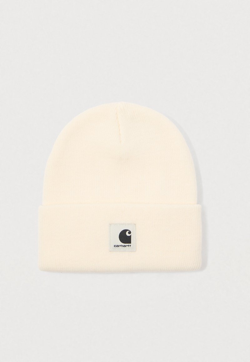Cream-colored knit beanie with folded brim and a square Carhartt logo patch centered on the front.