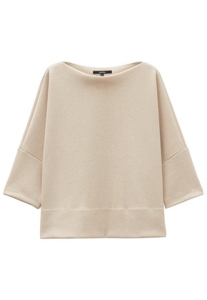 Beige oversized Oberteil aus geripptem Stoff. Mit weitem Bootsausschnitt und 3/4-Ärmeln. Gerader Saum mit lockerer Passform.
