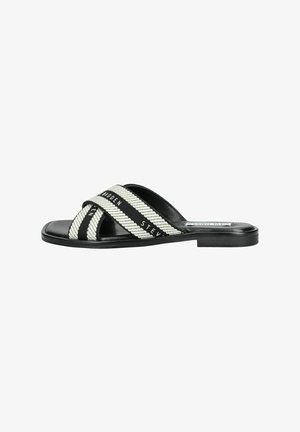Black and white striped slide sandal with woven fabric straps and a smooth leather footbed. Features a low-profile flat sole.
