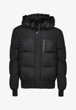 Veste noire rembourrée avec une capuche en fourrure amovible, poches latérales et une poche poitrine zippée. Comprend un ourlet et des poignets élastiques.