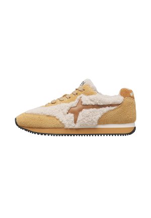 Low-top sneaker with beige suede and cream fleece panels, brown star detail, beige laces, and black rubber sole, viewed from the side.