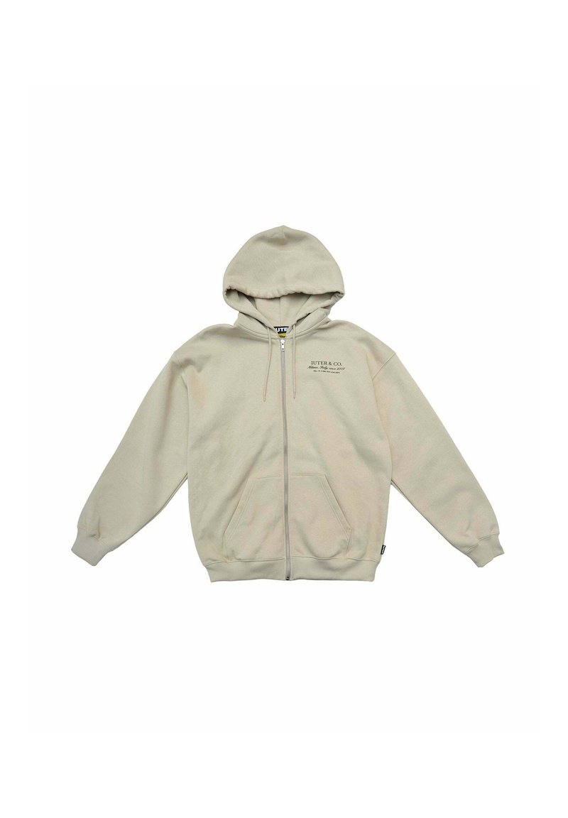 Felpa con zip beige, con cappuccio foderato, tasche frontali e polsini a costine. Presenta il logo del marchio stampato sul lato sinistro del petto. Texture del materiale morbida.