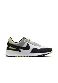 Zapatilla Nike de caña baja con paneles en blanco, gris, negro y amarillo pálido, logo de Nike en negro y suela de goma texturizada.