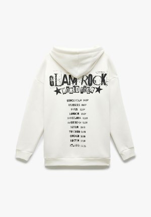 Felpa bianca con cappuccio caratterizzata da una grafica con la scritta "GLAM ROCK WORLD TOUR" in nero, con un elenco di città e date sottostante. Con cappuccio e vestibilità rilassata.