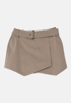 Beige wrap skirt with a belt, made from a smooth fabric. Features diagonal hems and visible stitching for a structured look.