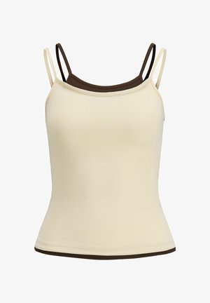 Deux camisoles superposées avec des bretelles fines, la devant beige et celle de derrière marron foncé.