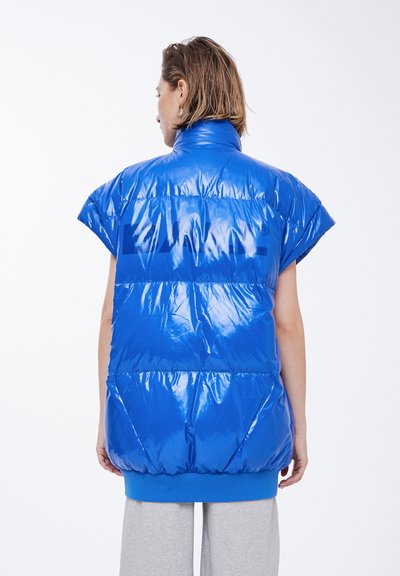 Puffy blue vest with a glossy finish, cap sleeves, high collar, and elastic hem. Features horizontal quilted patterns and branding.