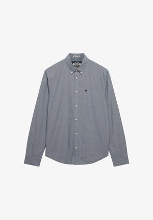 Chemise bleue à manches longues avec boutons, en tissu texturé, dotée d'une poche sur la poitrine gauche et de boutons de couleur claire.